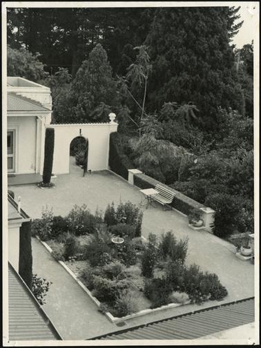 The image looks into the back patioed garden at Beleura