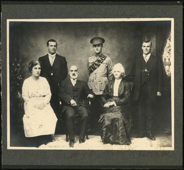 The image is of the Stone family, seated from left to right are Florence (b.1887), then parents, George and Emily (nee Davenport) standing from left to right are ??, Clive (b.1893) and Roy (b.1895)