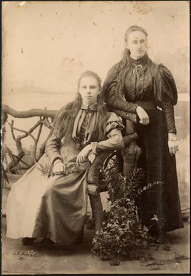 The image is of Joseph Firth's two daughters, one seated and the other standing c1900