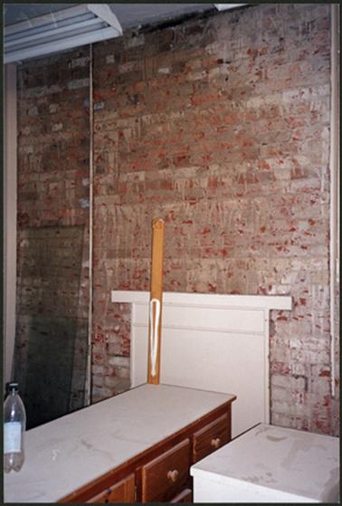 The image shows the kitchen area where it was being treated for rising damp