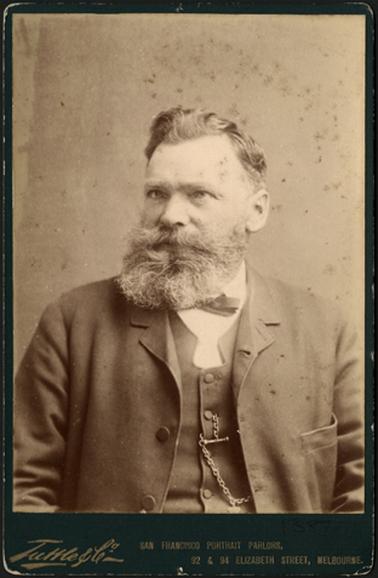 A head and shoulders photo of Mr W. Bradford looking away from photographer