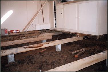 The image shows the new floor in the back room (kitchen)  in the process of being layed at the OPOM Mornington