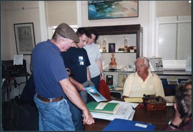Onlookers watching Bill Hall operating the ‘jigger’ for a Morse Code demonstration