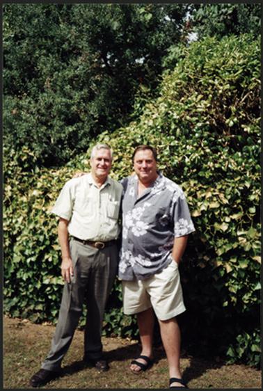 Neil Taylor (left) and Chris Swinbank (right) standing in front of shrubbery