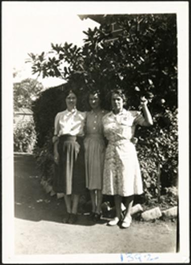 The image is of Wyn Bradford on right with a family member and a friend