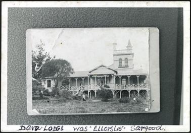 The house being two storey with a two level verandah and tower