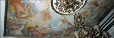 A colourful painting of angels and cherubs on a ceiling at Beleura also in photo ceiling rose and chandelier