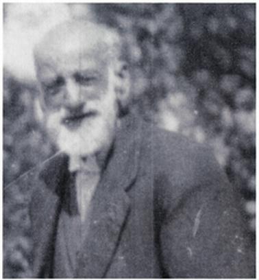 The photo shows a head and shoulders image of George Stone, slightly turned to the right