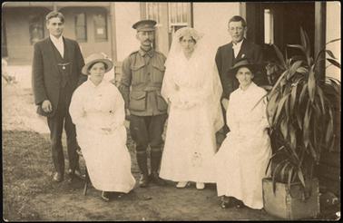 A group photo of the wedding of Florence Stone and Charles Thomas. From left to right Hugh Stone, Flo's friend, Charles and Flo, Charles friend and Emily (Cis) Stone