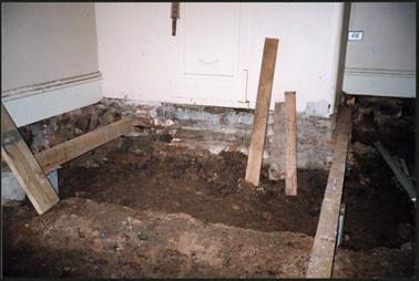 The new floor of the main room in the process of being built, the strongroom at rear