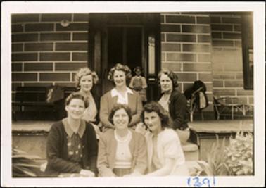 The image is of six women (Bradford family?) sitting on the front steps at Ballochmyle