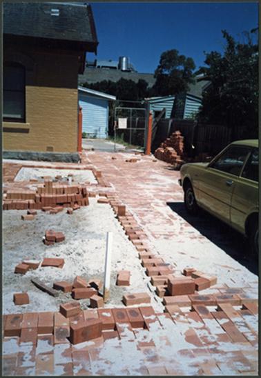 A view of the work in progress on the paving outside the freshly painted Old Post Office Museum 