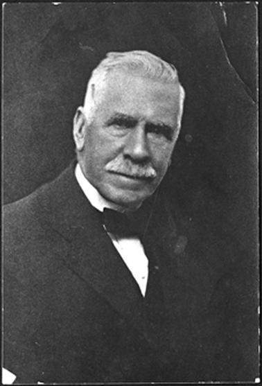 The image is of Alfred Downward who appears to be dressed for a political meeting/party