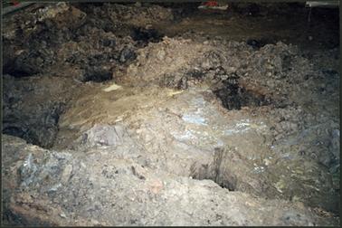 The image shows mud and slush under the floor of the main room OPOM