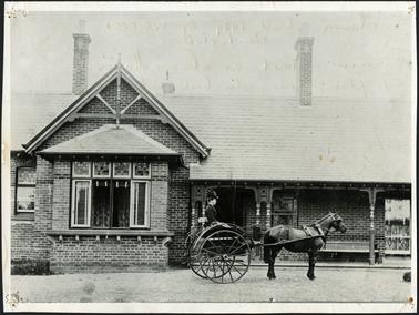 This large single-storeyed and verandahed house is built from coloured brickwork, has a hipped and slated roof, separately roofed window bays and protruding king-post trussed and helm - hipped gables
Queen Anne revival attributes