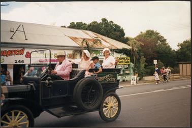 Mornington Historical Society Members in period costume, taking part in the Australia Day Parade 1989, these being Mr J. Olson, Mrs O. Sampson, Mrs J. Unsworth and Michael Addicott                                                                                                                    