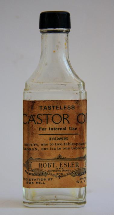 Glass bottle for castor oil. Flat bottle with neck and Bakelite lid. 
