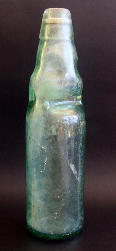1. Clear green bottle with glass marble.  Heavy indentations in top third.
