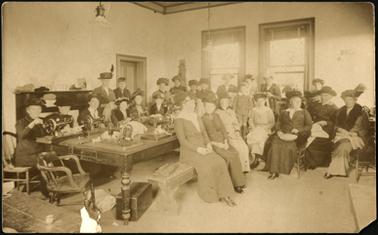Image 1. The image shows a group of ladies gathered together, some with sewing machines in the Shire Room, making garments for soldiers of W.W.1. (Red Cross)

Image 2. A view from Beleura Hill, Barkly St.? showing in foreground Sweeting’s house, Whitby St., ‘Mossgiel’, Bath St. right hand corner 