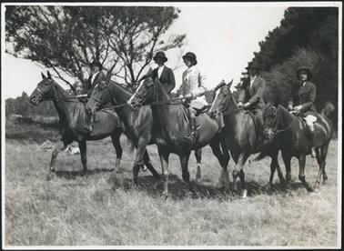 The photo is of a group of women on horseback, D. Smith, L. Dunstan, Miss Embling, N. Grice, B. Erswell at the Hartley Gymkhana