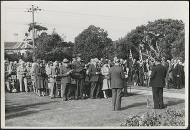 The image shows members of the Public and Army Personnel at perhaps an Anzac Day or Australia Day Service