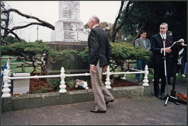 The image shows Mr James Reid Caldwell, reading the names on the monument, also to the right of the photo are Neil Taylor, reading the service, Stephen Noonan, Grandson of Rev Caldwell and Rev Venn