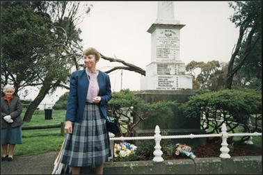 The image shows a group gathered at the Remembrance Service for the Footballers, included are Lindsay Firth and Mrs B. Samuel, relatives