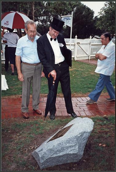 The photo is of Neil Taylor (in top hat) and Harry Downward reading the plaque for the Centenary Celebration of the Mornington Cemetery 1.3.92.