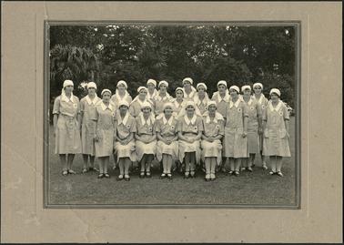 The image shows a group of twenty Red Cross Voluntary Aid Detachment V.A.D. Nurses Pre World War 2