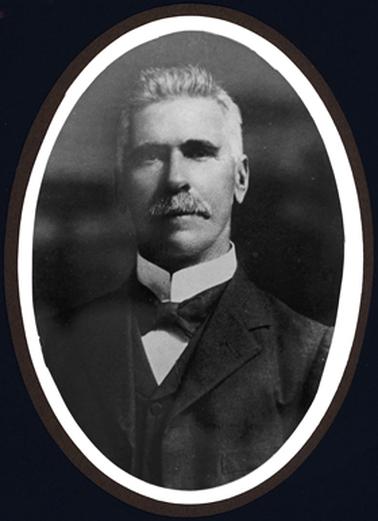 Head and shoulders portrait of Alfred Downward. Appears to be an official portrait.