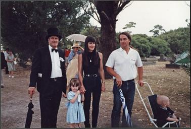 A group photo with Neil Taylor in top hat, and members of the Downward family, when attending the Mornington Shire Centenary for the Mornington Cemetery
